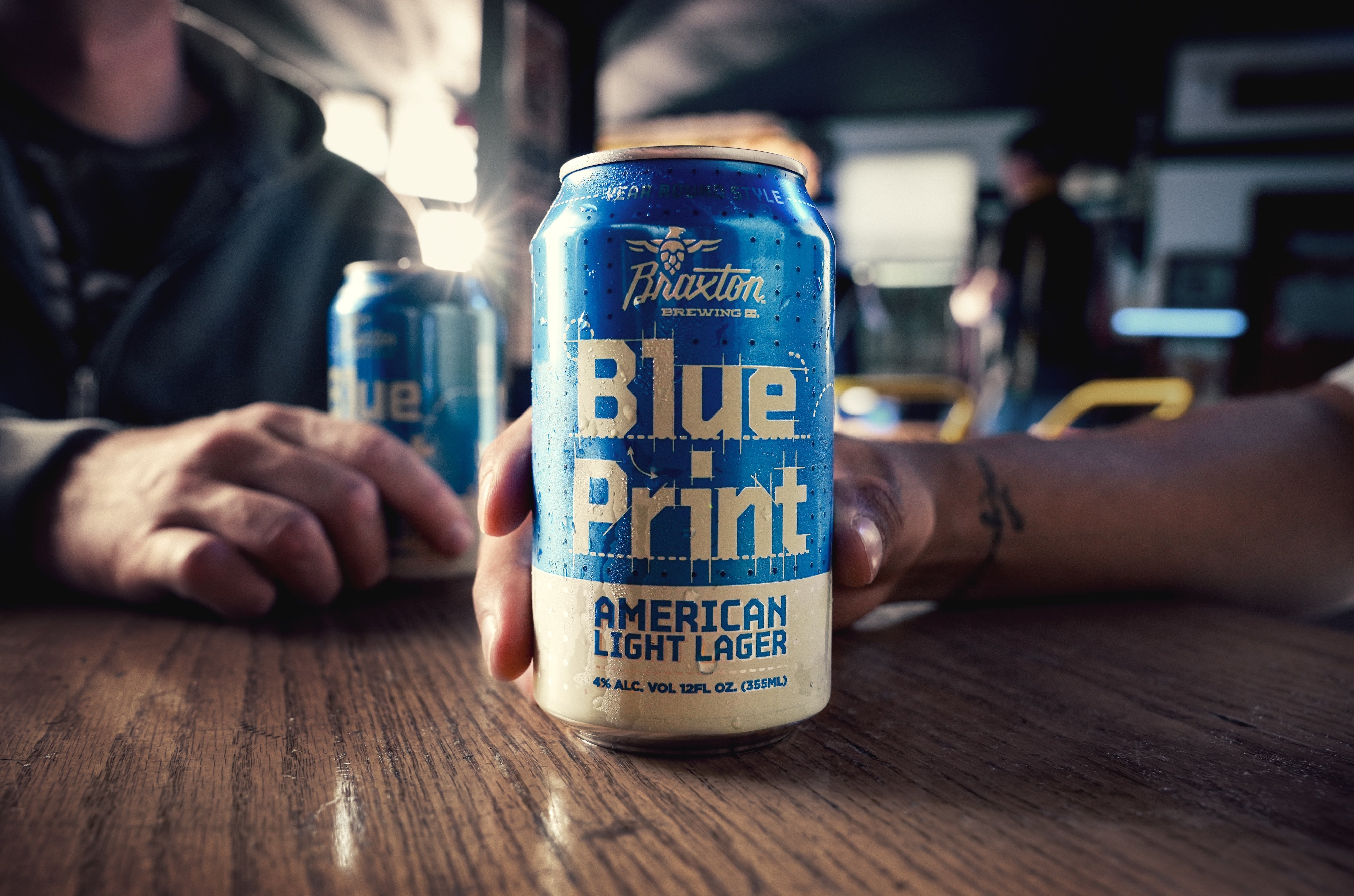 Two Blue Print cans on a taproom bar